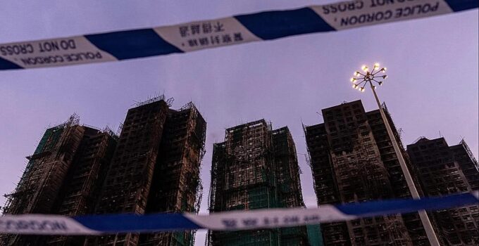 Hong Kong authorities say netting on buildings that caught fire did not meet code