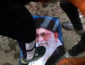 Protest creativity: Iranian women light cigarettes on burning portrait of the ayatollah