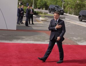 Kissing babies, singing chansons: Macron touts Armenia’s ‘new era,’ stealing the show at EPC summit