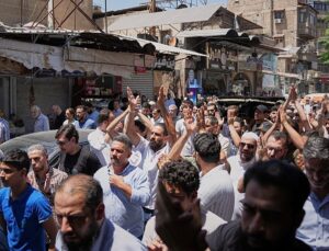 Mourners in Damascus bury cafe bomb blast victims as officials promise justice